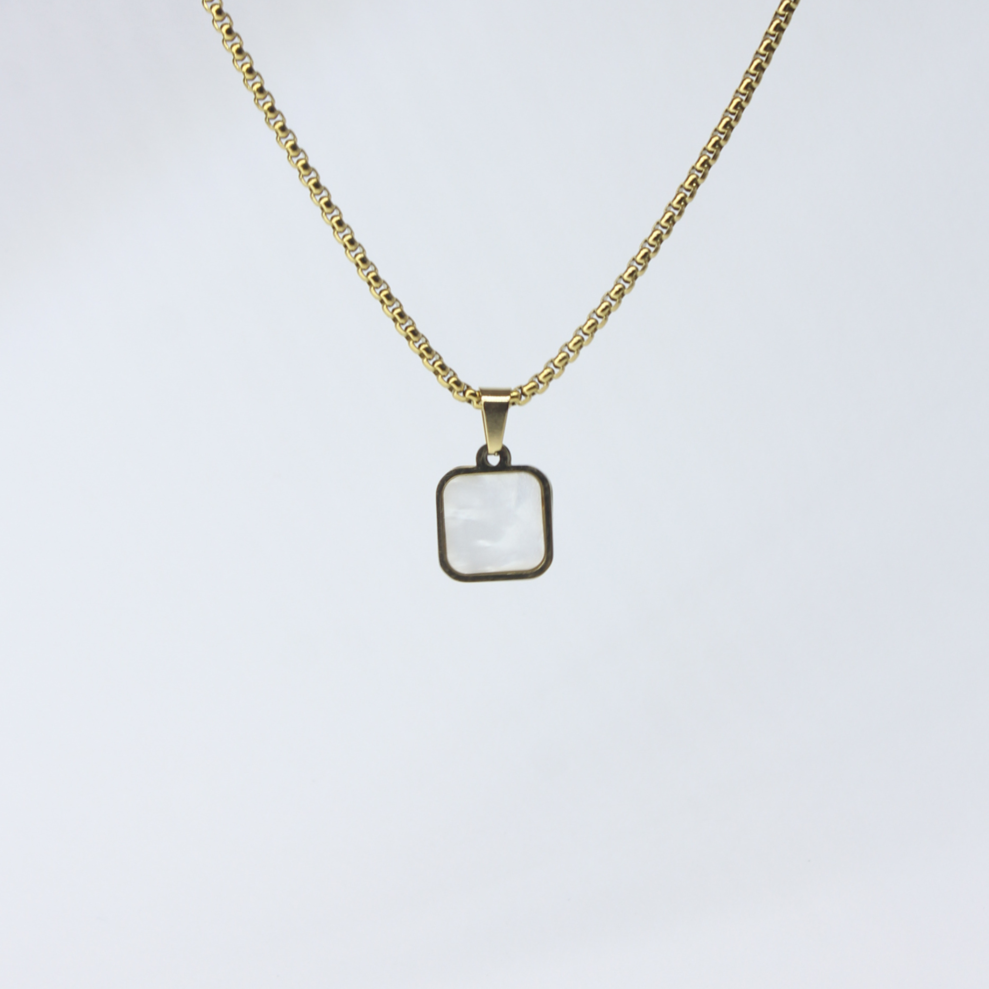 Buy Azure Rectangular Golden Tone White Black Pendant in Pakistan