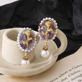 Buy Orb & Gravel Purple Stone Gold Rose Earrings in Pakistan