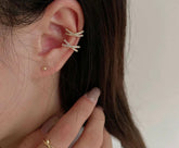 Buy Orb & Gravel Cross Gem Earcuff Gold Pair in Pakistan