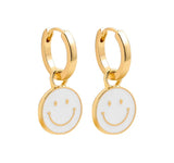 Buy Orb & Gravel Smiley White Huggie Hoop Gold in Pakistan