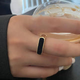 Buy Orb & Gravel Black Gem Bar Gold Ring in Pakistan