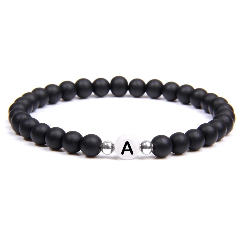 Buy Orb & Gravel A Initial White & Black Bead Bracelet in Pakistan