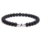 Buy Orb & Gravel A Initial White & Black Bead Bracelet in Pakistan