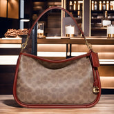 Buy Coach Cary Signature Canvas & Leather Crossbody Small Bag - Tan Rust in Pakistan