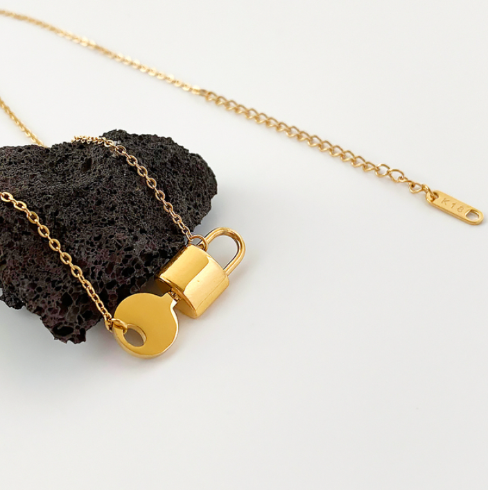 Buy Orb & Gravel Lock Key Gold Plated Necklace in Pakistan
